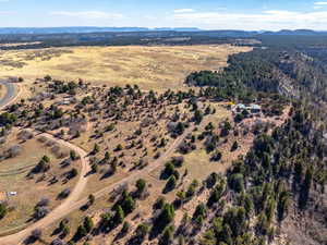 Aerial view of property's location featuring mountains and rural landscape
