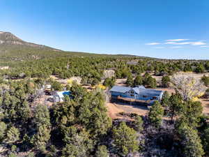 View of subject property with a forest