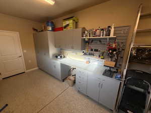 4th car stall with mini-split and epoxy floor used as workshop.  Door leads into Casita Bathroom