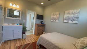 Castia Bedroom (3rd bedroom)featuring light wood-type flooring and recessed lighting, and a sink and vanity