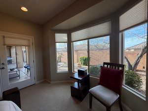Bay window and door to covered patio in primary bedroom