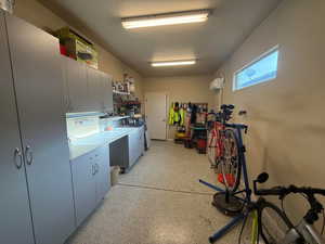 4th car stall with mini-split and epoxy floor used as workshop