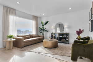 Living area featuring wood finished floors and recessed lighting
