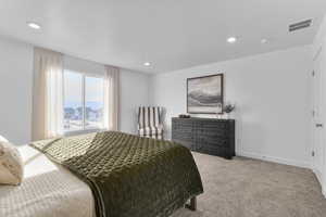 Bedroom with carpet floors and recessed lighting
