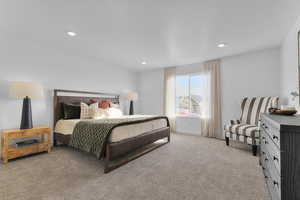 Bedroom featuring light carpet and recessed lighting