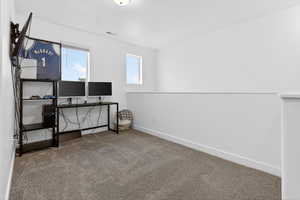 Unfurnished office featuring baseboards and carpet floors