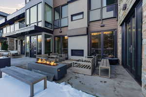 Patio / terrace with a patio and an outdoor living space with a fire pit