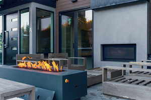 View of patio / terrace featuring an outdoor living space with a fire pit