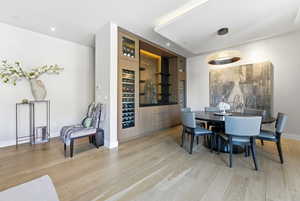 Dining room featuring light wood-style flooring and recessed lighting