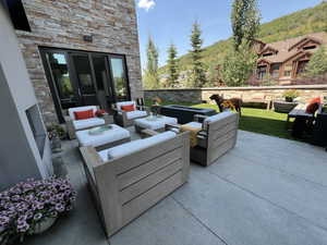 View of patio with an outdoor hangout area and a mountain view