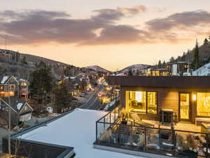 Back of property with a patio area and a mountain view