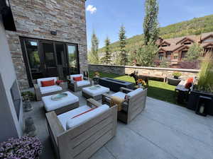 View of patio / terrace featuring an outdoor hangout area and a mountain view