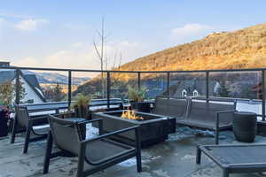 View of patio / terrace featuring a mountain view and an outdoor fire pit