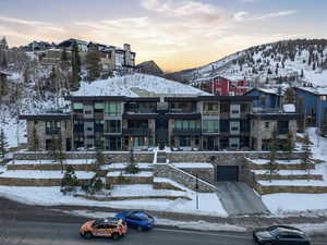 Snow covered building featuring a mountain view