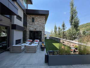 View of patio / terrace featuring an outdoor hangout area and a mountain view