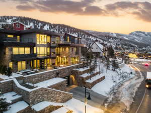 View of property's community featuring a balcony and a mountain view