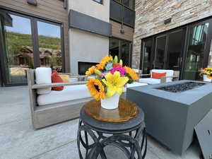 View of patio featuring a fire pit