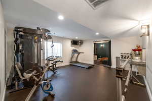 Exercise room featuring recessed lighting
