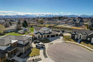 Aerial perspective of suburban area featuring a mountainous background