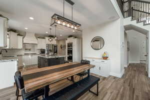 Dining space featuring light wood-style flooring and recessed lighting