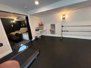 Workout area featuring baseboards