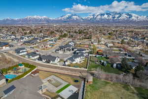 Aerial overview of property's location with mountains and nearby suburban area