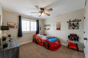 Bedroom featuring carpet flooring and ceiling fan