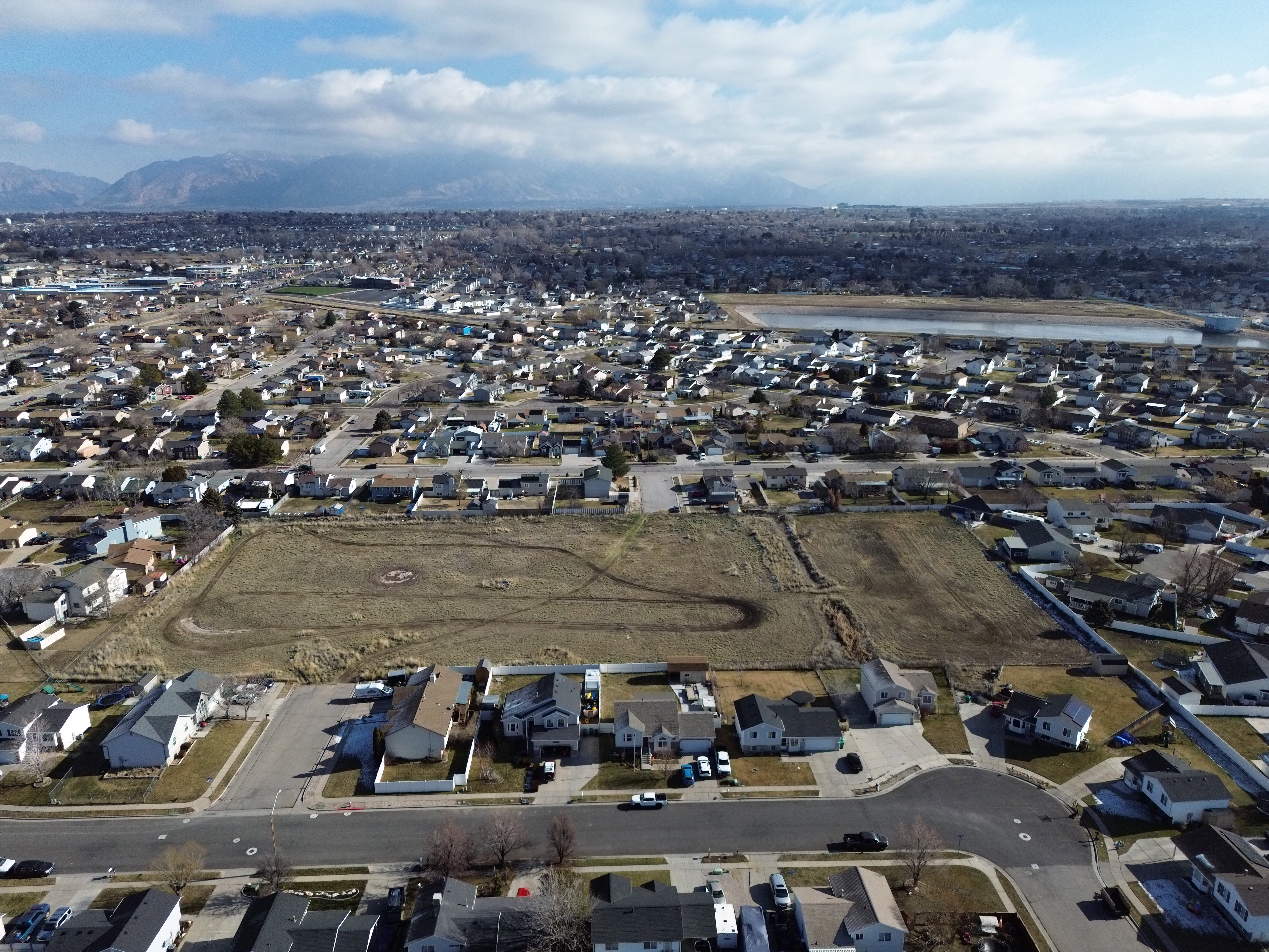 Aerial overview of property's location featuring nearby suburban area