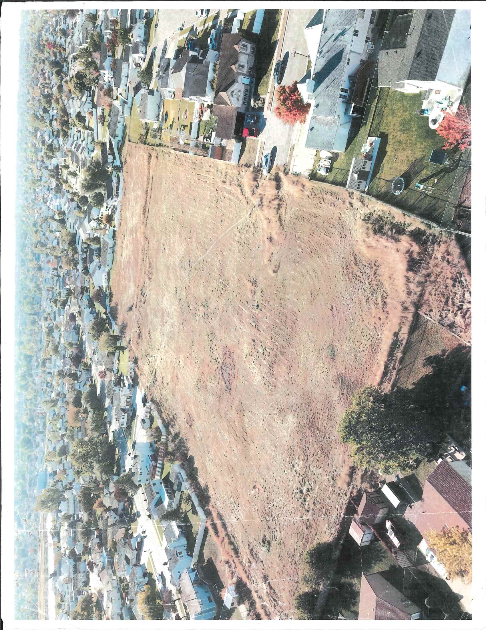 Aerial overview of property's location with nearby suburban area