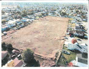 Aerial overview of property's location with nearby suburban area