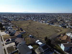 Aerial view of property's location with nearby suburban area