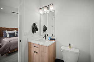 Ensuite bathroom featuring vanity and toilet