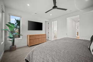 Bedroom with light carpet, a ceiling fan, and recessed lighting