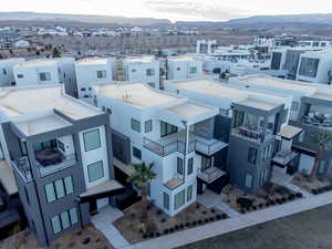 Aerial perspective of suburban area with a mountainous background