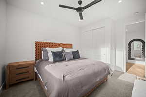 Bedroom with recessed lighting, a closet, a ceiling fan, and carpet