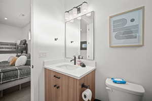 Bathroom featuring vanity and toilet