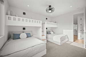 Bedroom with recessed lighting and carpet