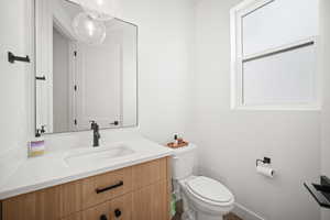 Bathroom with toilet and vanity
