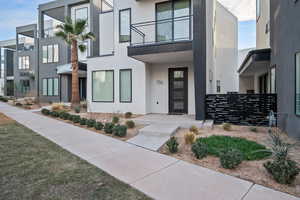 Entrance to property with stucco siding