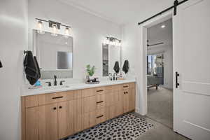 Ensuite bathroom with double vanity and recessed lighting