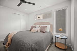 Bedroom featuring ceiling fan, a closet, and carpet flooring