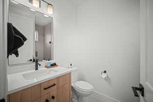 Full bath featuring vanity, a shower stall, and light tile patterned floors