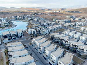 Aerial overview of property's location featuring a mountainous background