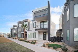 Modern home with a balcony and stucco siding