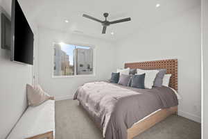 Carpeted bedroom featuring ceiling fan and recessed lighting