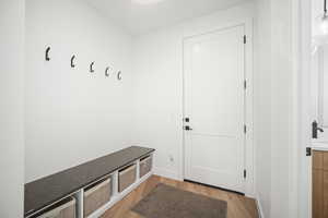 Mudroom with light wood-style floors