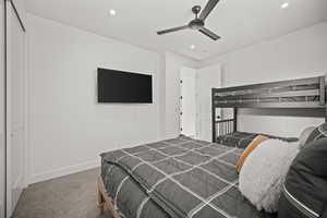 Bedroom with carpet flooring, recessed lighting, a ceiling fan, and a closet