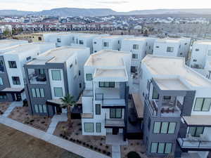 Aerial perspective of suburban area with a mountainous background