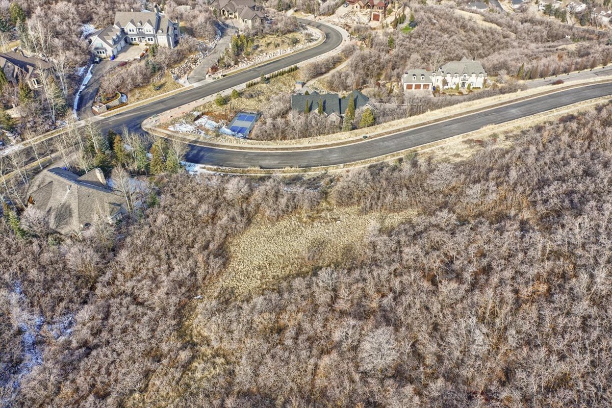 Aerial view of property's location featuring nearby suburban area