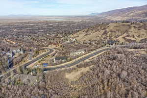 Aerial view of property and surrounding area with mountains
